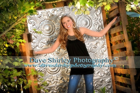 Portrait photo taken outdoors with ceiling tiles backdrop